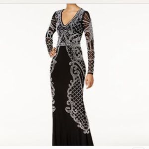 Xscape Long sleeve long black embellished gown.